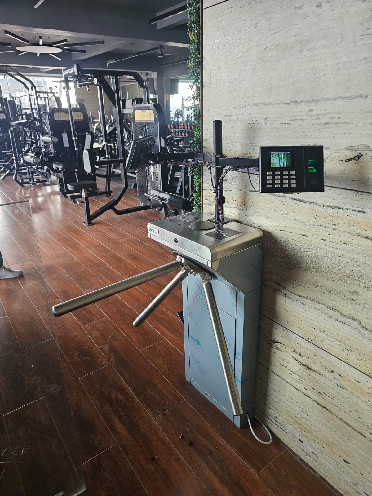 Turnstile with biometric device installed at a gym in India